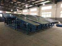 GRAVITY VEHICLE UNLOADING CONVEYOR SYSTEMS