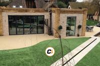 RESIN BOUND STONE AND ARTIFICIAL LAWN INSTALLATION SOLVES WATERLOGGED GARDEN
