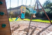 How to Anchor a Swing Set on Artificial Grass