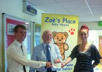 Delighted Staff Present Fundraising Cheque to Zoes Place