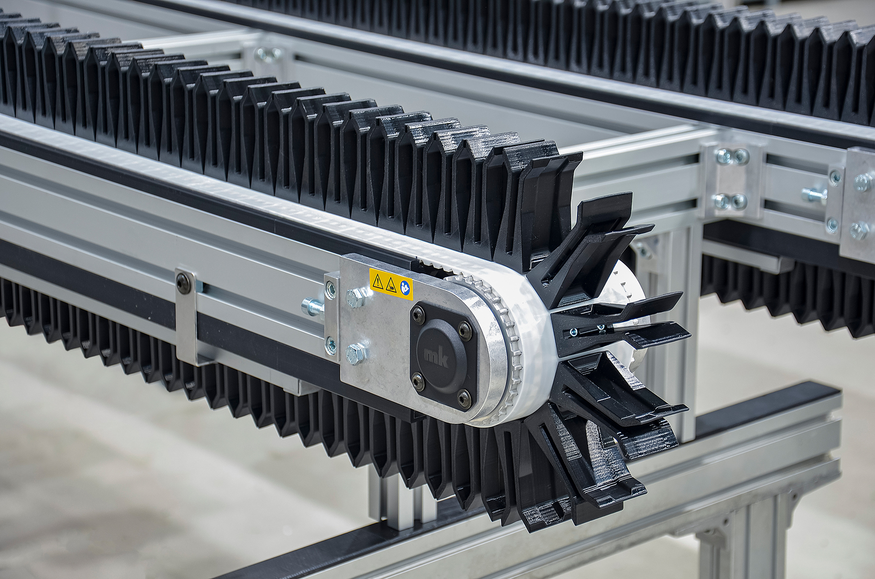 3D-printed holders enable cost-efficient conveying solution