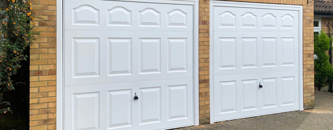 A Pair of Garador Cathedral Steel Up & Over Garage Doors in White
