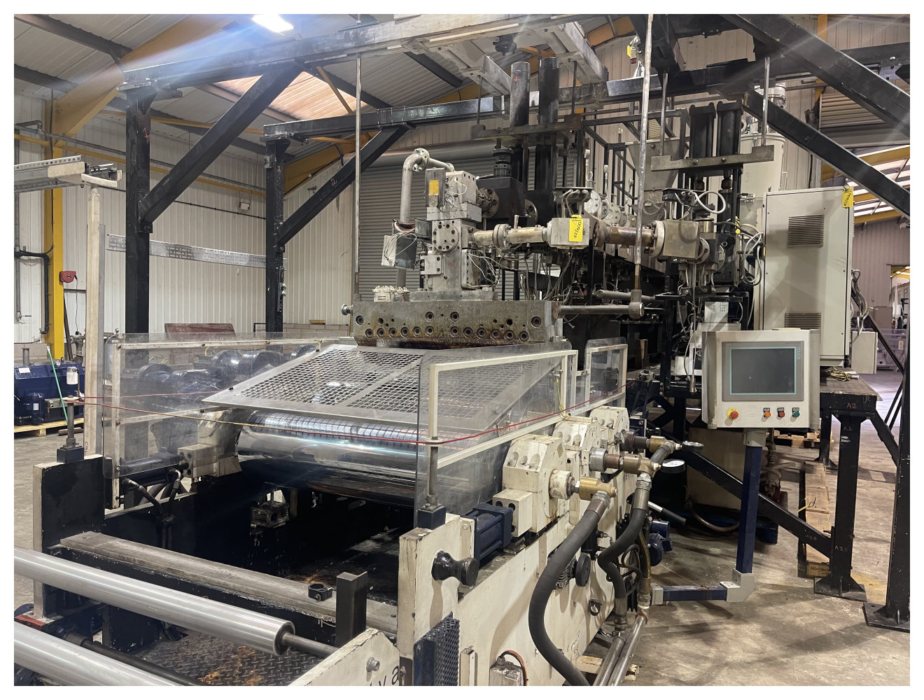 UK Suppliers Of 1100mm wide 500kg/hr twin screw PET sheet extrusion line with 82mm 40D co rotating twin screw, coex dual s/changer, g/pump, 3 roll stack, winder. 2011