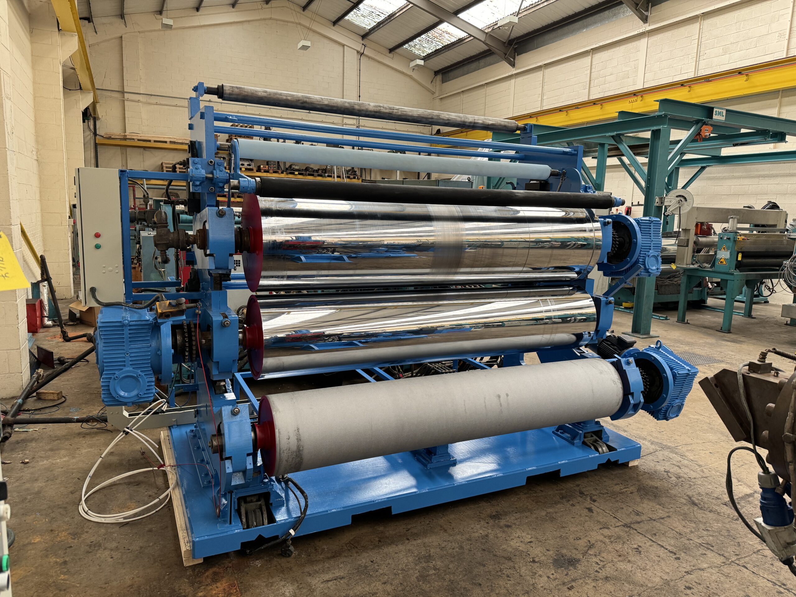 2440mm wide Davis Standard/Sterling 3 roll polishing stack, with haul off and guillotine. 2400mm wide EDI flex lip die. 600mm + 500mm diameter rolls.