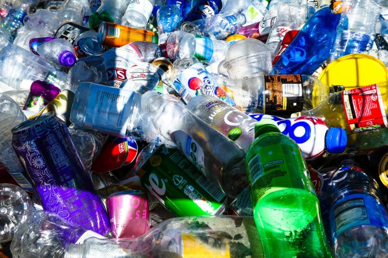 How can a waste baler mitigate plastic pollution?