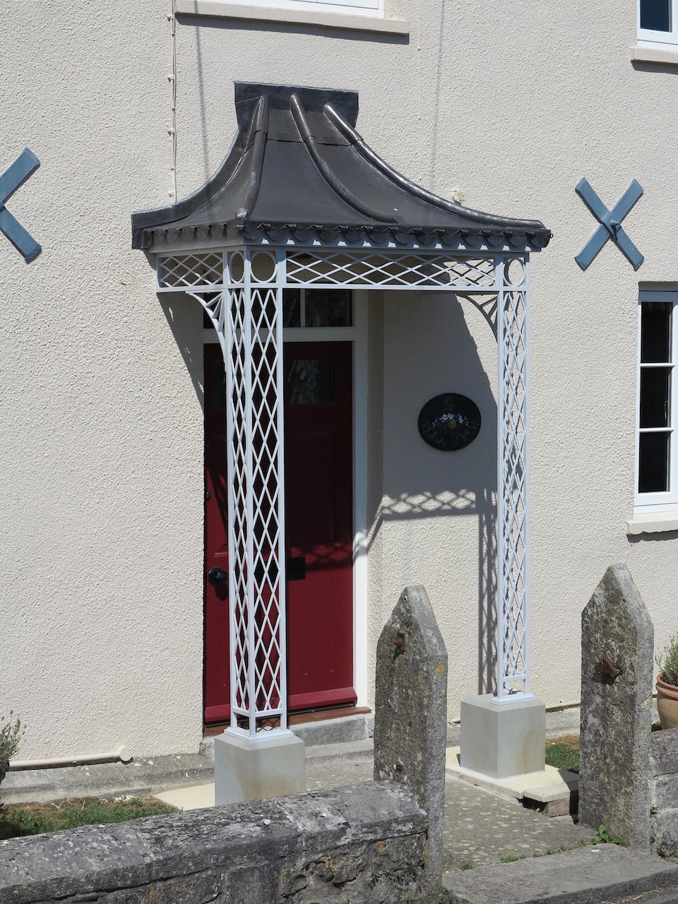 Trellis Wrought Iron Porch with Stone Plinths & Traditional Lead Roof