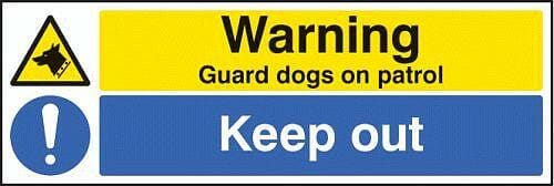 Warning guard dogs on patrol keep out