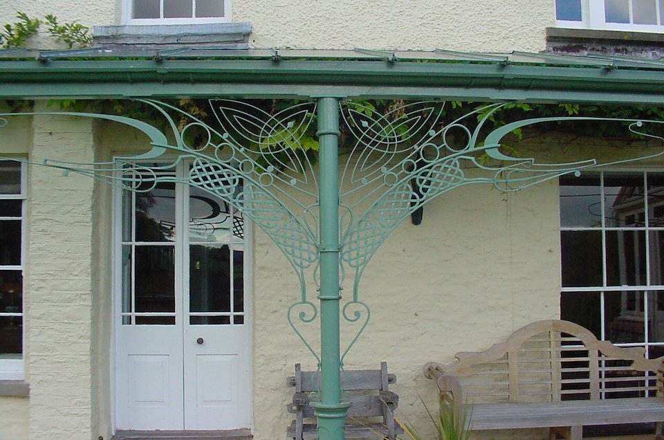 Ornate Metalwork Veranda with Glazing Bar Roof Frame