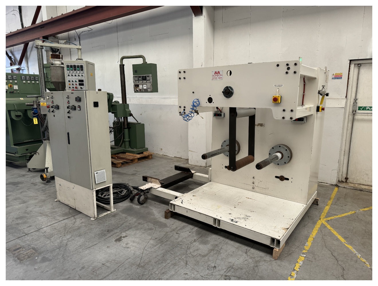 600mm Wide Mondon Dual Station Winder. 500mm Max roll diameter 500mm. Model 1711 1998. PET sheet