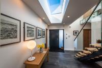 FRAMELESS ROOFLIGHTS HELPS ACCENTUATE THE OPEN PLAN CONTEMPORARY STYLE OF THIS NEW BUILD DWELLING