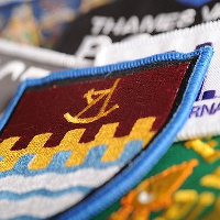 EMBROIDERED BADGE.