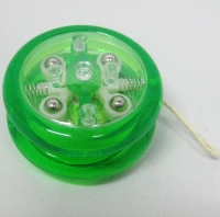 ROUND FLASHING LIGHT UP CLUTCH YOYO in Translucent Green Plastic.