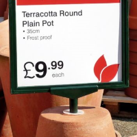 A4 sign fixed to upturned plant pot