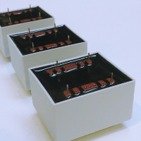 Frame Fixing Laminated Transformers