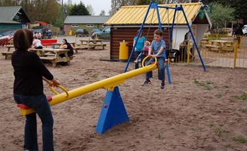 Maintenance Of Traditional Playground Seesaw