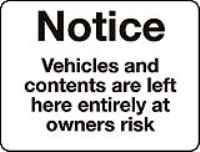 Vehicles and contents are left here entirely at owners risk sign