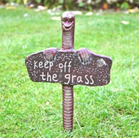 Keep off the grass sign worm spike
