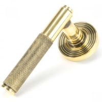 Brompton Unsprung Lever Door Handle on Beehive Rose Set - Aged Brass