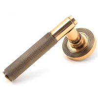 Brompton Sprung Lever Door Handle on Beehive Rose Set - Polished Bronze