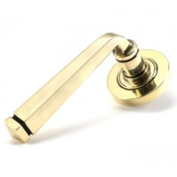 Avon Unsprung Lever Door Handle on Round Rose Set - Aged Brass