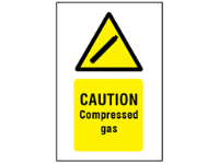Caution compressed gas symbol and text safety sign.