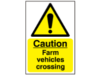 Caution, farm vehicles crossing safety sign.