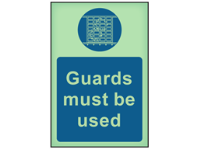Guards must be used photoluminescent safety sign