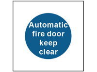 Automatic fire door keep clear safety sign.