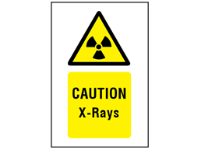 Caution x-rays symbol and text safety sign.