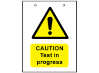 Caution, test in progress safety sign.