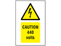 Caution 440 volts symbol and text safety sign.